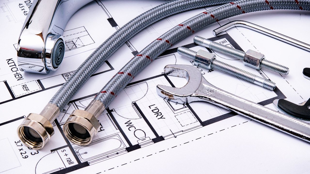 Plumbing connections and tools on a plan