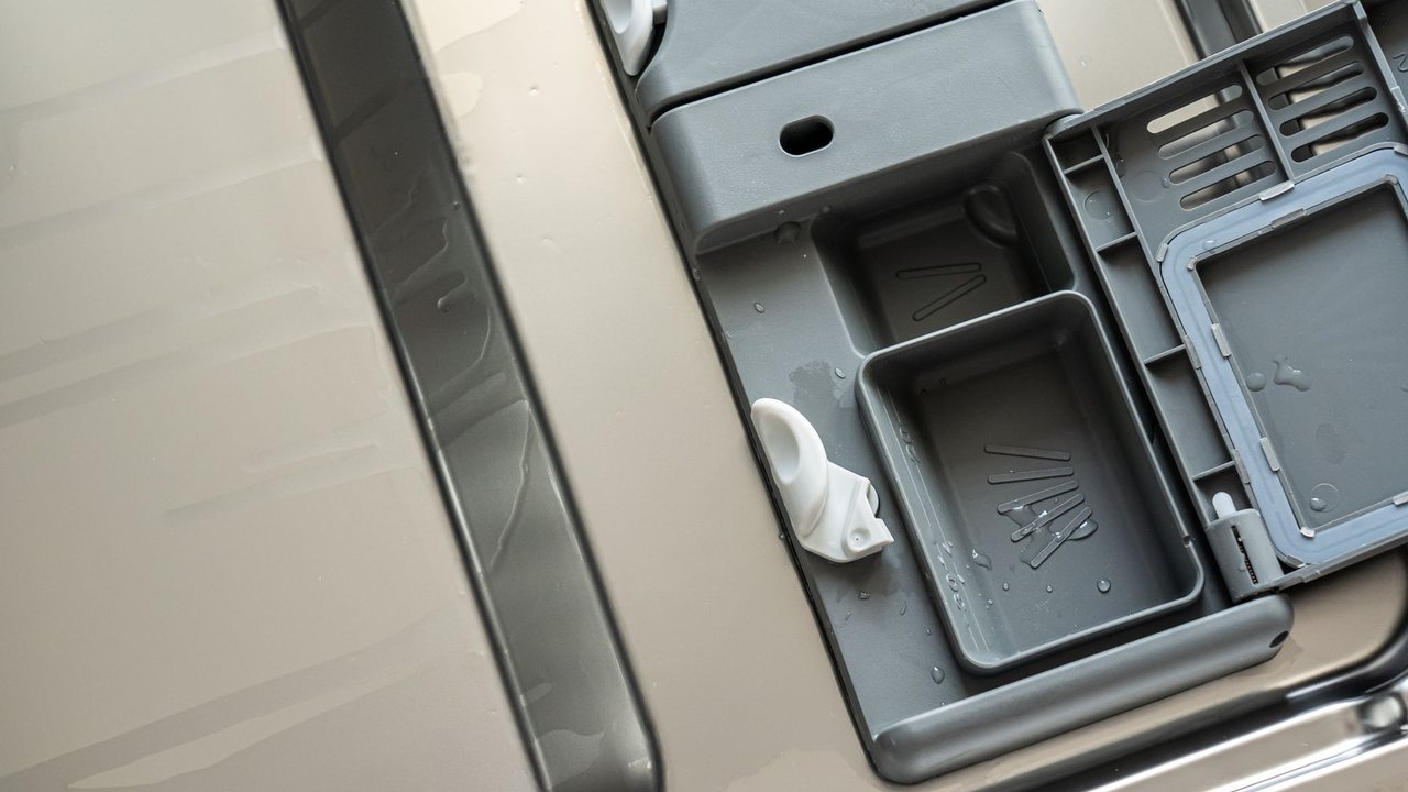 Detergent compartment inside an open dishwasher
