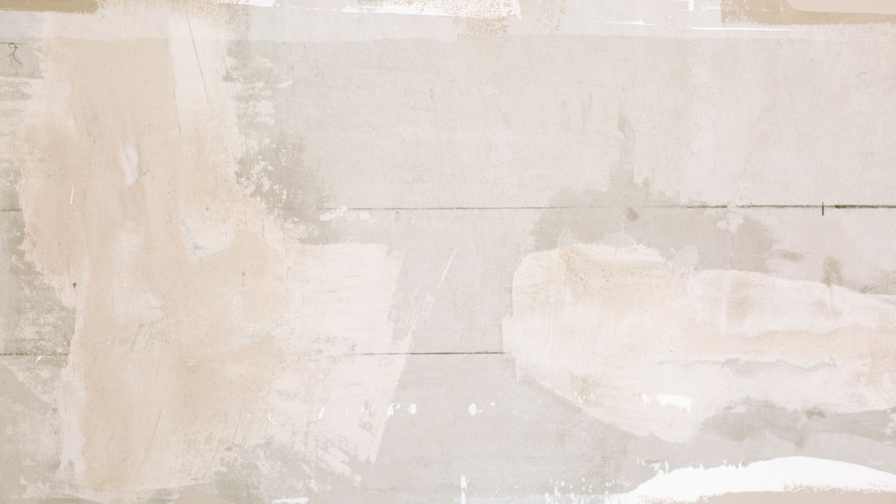 Detail of a wall being prepared with patches of coating and repairs